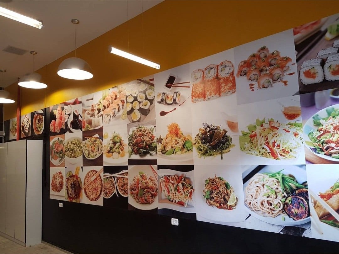 Food imagery fills a restaurant feature wall.